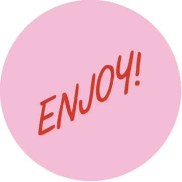 Pink circular sticker with red 'ENJOY!' text.